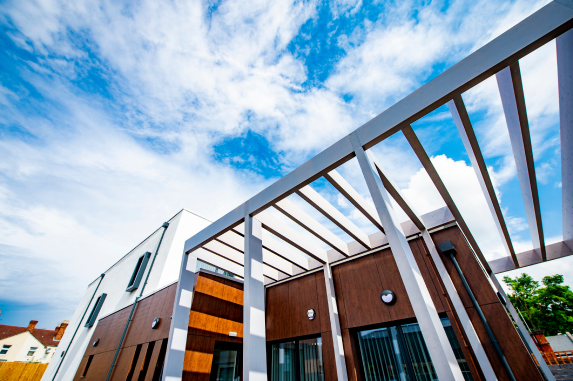 Glulam timber feature entrance canopy by Kensington Systems at Foleshill Health Centre, Coventry